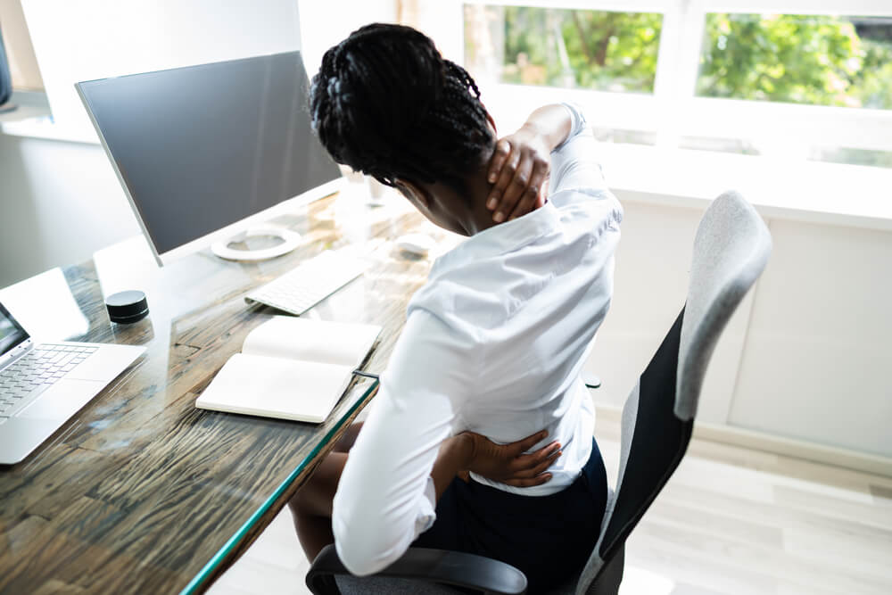 Three posture corrections that can reduce your pain when sitting