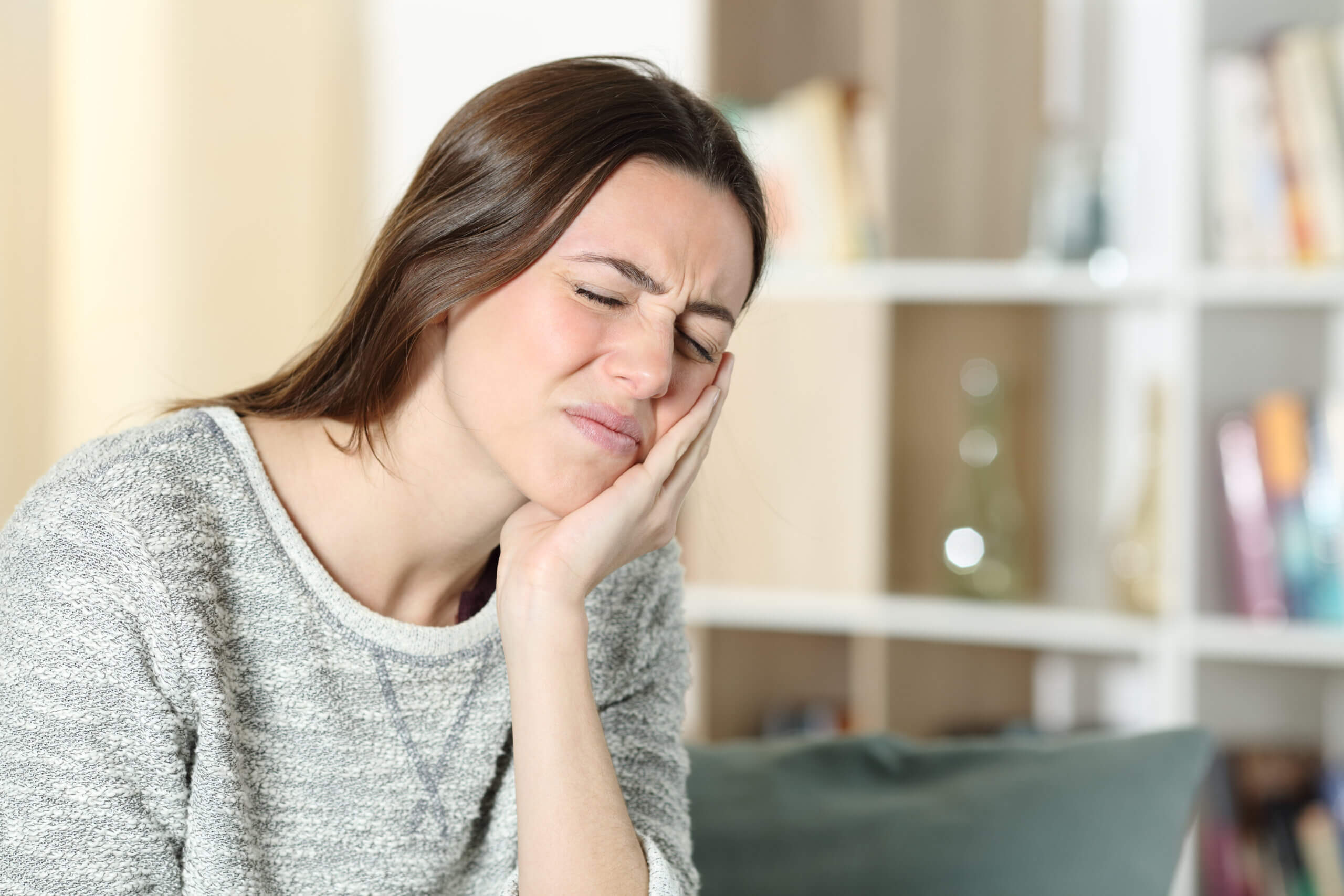 6 TMJ dysfunction symptoms you may be feeling in your ear